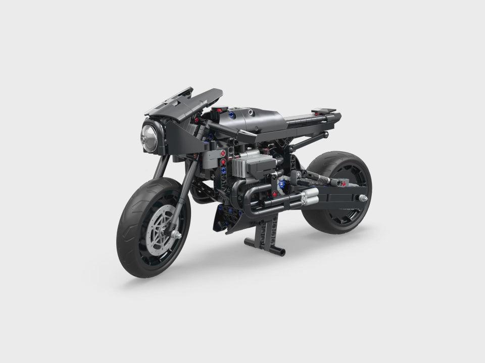 Unleash your inner superhero with LEGO Technic Batcycle 42155! Authentic movie details, working parts, and impressive display potential. Ages 9+.