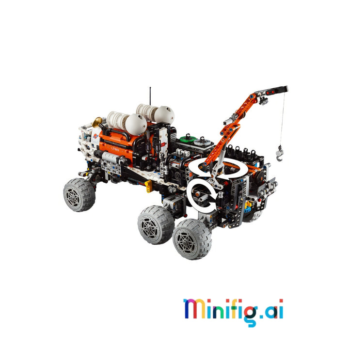 A complex toy construction vehicle made from LEGO Technic-style bricks, featuring a black and orange chassis, three gray wheels, a crane arm, and white cylindrical tanks.